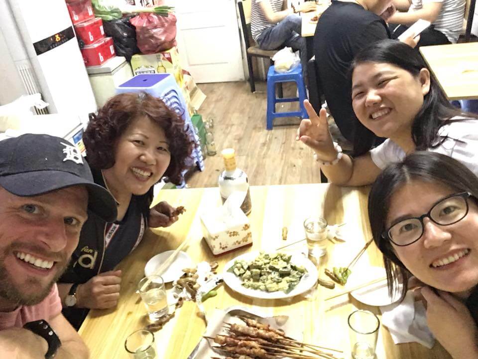 Student having dinner with host family in Chengde
