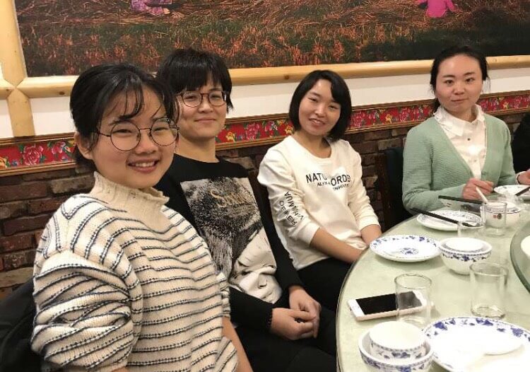 Staff and students at a restaurant having dinner in Shanghai