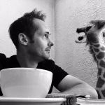 David at Giraffe Coffee, with a Giraffe